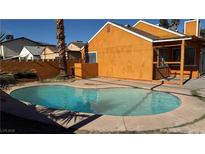 Inviting kidney-shaped pool with surrounding patio at 5453 Requa Ave, Las Vegas, NV 89110