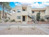 Attractive exterior of a condo building with stairs and landscaping at 601 Cabrillo Cir # 323, Henderson, NV 89015