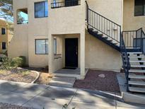 Condo building exterior with stairs and landscaping at 601 Cabrillo Cir # 323, Henderson, NV 89015