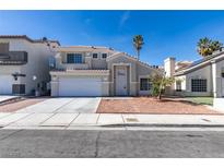 Charming two-story home featuring a well-maintained lawn, palm trees, and a two-car garage at 7233 Eaglegate St, Las Vegas, NV 89131