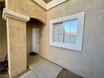 Inviting entryway with white door and window, leading into the condo at 833 Aspen Peak Loop # 1014, Henderson, NV 89011