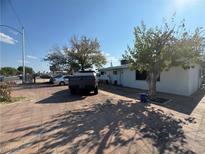 House exterior with parking and a tree in front at 2127 Crawford St, North Las Vegas, NV 89030