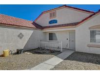 Well-maintained house with a red tile roof and walkway at 2715 Coral Cliffs Ct, North Las Vegas, NV 89031