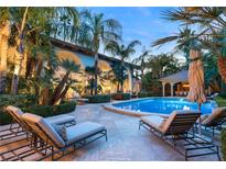 Relaxing pool area with lounge chairs and patio at 3074 Monte Rosa Ave, Las Vegas, NV 89120