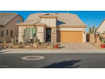 Single-story home with desert landscaping and two-car garage at 3096 Beaux Art Ave, Henderson, NV 89044