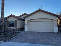 One-story home with attached garage and landscaped front yard at 3363 Blue Ribbon Downs St, Las Vegas, NV 89122