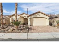 Charming single-story home featuring a two-car garage and desert landscaping at 3363 Blue Ribbon Downs St, Las Vegas, NV 89122