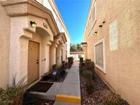 Charming home exterior featuring well-maintained landscaping and a secure ADT security system at 6449 Stone Dry Ave # 101, Henderson, NV 89011