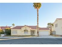 Single-story house with a two-car garage and desert landscaping at 6617 Old Newbury Ave, Las Vegas, NV 89108