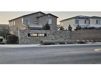 Stone Creek community entrance with two-story homes at 7050 Fossil Rim St, Las Vegas, NV 89084