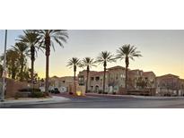 Attractive two-story building with palm trees and gated entrance at 9975 Peace Way # 2089, Las Vegas, NV 89147