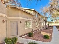 Tan two-story building with gray doors and walkway at 100 S Crestline Dr # 57, Las Vegas, NV 89107