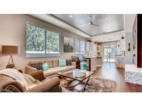 Bright living room with hardwood floors, comfortable seating, and an open floor plan at 1036 Novara Ln, Las Vegas, NV 89144