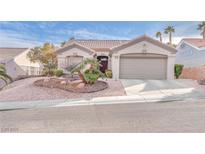 Charming single-story home with landscaped front yard and attached two-car garage at 10725 Sky Meadows Ave, Las Vegas, NV 89134