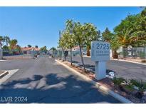 Condominium entrance with gated access and signage at 2725 S Nellis Blvd # 1140, Las Vegas, NV 89121