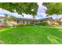 Ranch style home with a spacious lawn and mature trees at 2908 Bryant Ave, Las Vegas, NV 89102