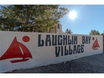 Laughlin Bay Village entrance sign with sailboat accents at 3791 Desert Marina Dr # 118, Laughlin, NV 89029