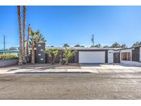 Charming single-story home featuring a modern architectural style and manicured front yard with desert landscaping at 3809 San Angelo Ave, Las Vegas, NV 89102