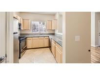 Bright kitchen with stainless steel appliances and granite countertops at 5250 S Rainbow Blvd # 2056, Las Vegas, NV 89118