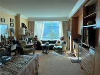 Spacious living room with city view and comfortable seating at 2000 N Fashion Show Dr # 1704, Las Vegas, NV 89109