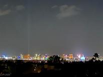 Nighttime view of the city skyline, showcasing bright lights and architectural beauty in a desirable urban setting at 2255 Potter Lake Ave, Henderson, NV 89052