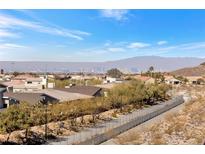 Expansive city view from a neighborhood with desert landscaping and a scenic walking path at 2255 Potter Lake Ave, Henderson, NV 89052