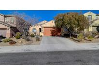 Single-story home with a two-car garage and desert landscaping at 2694 Kinghorn Pl, Henderson, NV 89044