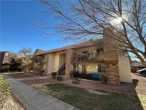 Two-story building with balconies and landscaping at 5181 River Glen Dr # 172, Las Vegas, NV 89103