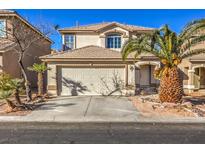 Two-story house with attached garage and landscaped yard at 7163 Brassica Ct, Las Vegas, NV 89148