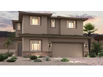 Two-story home with attached garage and desert landscaping at 852 Camargo St, Henderson, NV 89011