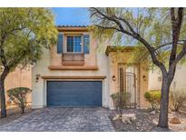 Two-story house with gray garage door and landscaped yard at 9802 Twin Mill St, Las Vegas, NV 89178