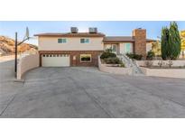 Two-story house with attached garage and basketball court at 1400 San Felipe Ct, Boulder City, NV 89005