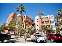 Modern condos featuring balconies, desert landscaping and ample parking at 23 E Agate Ave # 506, Las Vegas, NV 89123