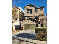 Three-story house with a two-car garage and well-manicured landscaping at 368 Gracious Way, Henderson, NV 89011