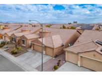 Aerial view of houses with solar panels and desert landscape at 9644 Padre Peak Ct, Las Vegas, NV 89178