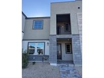 Modern two-story townhome with gray brick exterior and balcony at 127 Harmonica Ave # Lot 14, Henderson, NV 89011