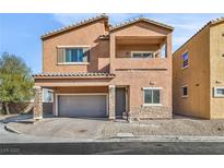 Two-story house with attached garage and front yard landscaping at 1992 Star Creek Bay Ln, Las Vegas, NV 89115