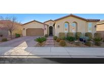 Charming one-story stucco home with a well-maintained lawn and a two-car garage at 2365 Boretto St, Henderson, NV 89044