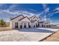 Charming new construction homes featuring modern design and spacious concrete parking at 380 Erin St, Pahrump, NV 89048