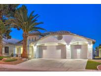 Attractive single-story home with a two-car garage and desert landscaping at 5306 Falling Petals Dr, North Las Vegas, NV 89031