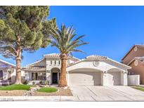 Beautiful single-story home with a two-car garage and landscaped front yard at 5306 Falling Petals Dr, North Las Vegas, NV 89031