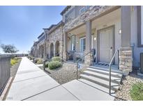 Townhouses with stone accents and private entrances at 6434 Spring Jog St, Las Vegas, NV 89166