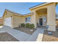Charming single story home featuring a well-maintained yard and covered entryway at 3709 Ferrell St, North Las Vegas, NV 89032