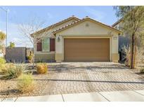 Charming single-story home with a well-maintained front yard and neutral color palette at 6318 Amber Sunrise St, North Las Vegas, NV 89031