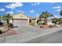 Single-story house with a two-car garage and desert landscaping at 1647 Fieldbrook St, Henderson, NV 89052