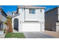 Two-story house with attached garage and landscaped front yard at 4358 Raynham St, Las Vegas, NV 89115