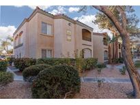 Tan two-story building with trees and landscaping at 7885 W Flamingo Rd # 1092, Las Vegas, NV 89147