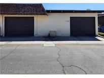 Two-car garage with dark brown doors and a spacious driveway at 2732 Heritage Ct # 0, Las Vegas, NV 89121