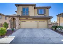 Two-story home featuring a three-car garage, balcony, brick accents and a drought tolerant yard at 3109 Madame Plantier Ave, North Las Vegas, NV 89081