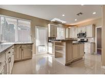 Spacious kitchen featuring granite countertops and upgraded cabinetry at 2245 Juniper Berry Dr, Las Vegas, NV 89134